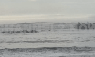 A powerful surge of extremely high surf battered the California coast on Monday, leading to the partial collapse of the iconic Santa Cruz Pier. The damaged portion of the pier broke away and was seen floating in the turbulent waters, underscoring the severity of the wave action caused by the extreme weather conditions.