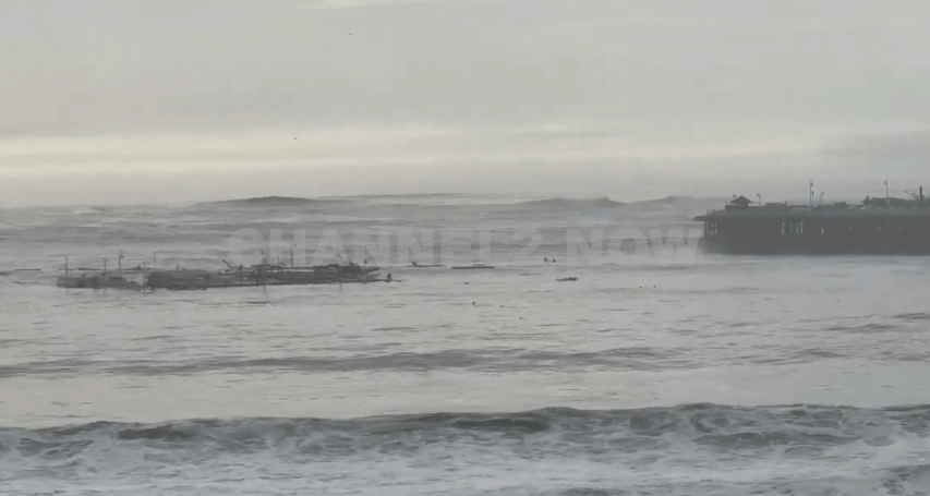 A powerful surge of extremely high surf battered the California coast on Monday, leading to the partial collapse of the iconic Santa Cruz Pier. The damaged portion of the pier broke away and was seen floating in the turbulent waters, underscoring the severity of the wave action caused by the extreme weather conditions.