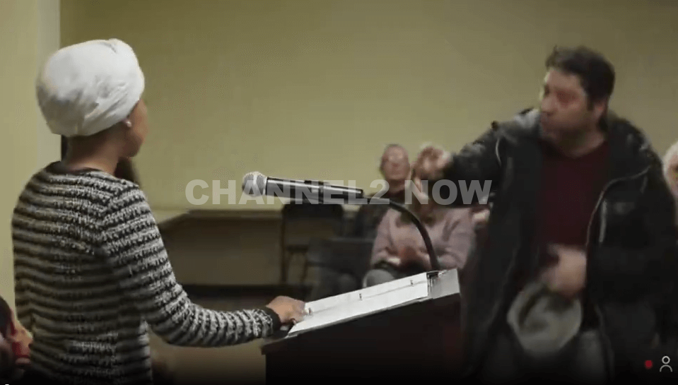 Man Detained After Spraying Ilhan Omar With Substance During Town Hall Meeting